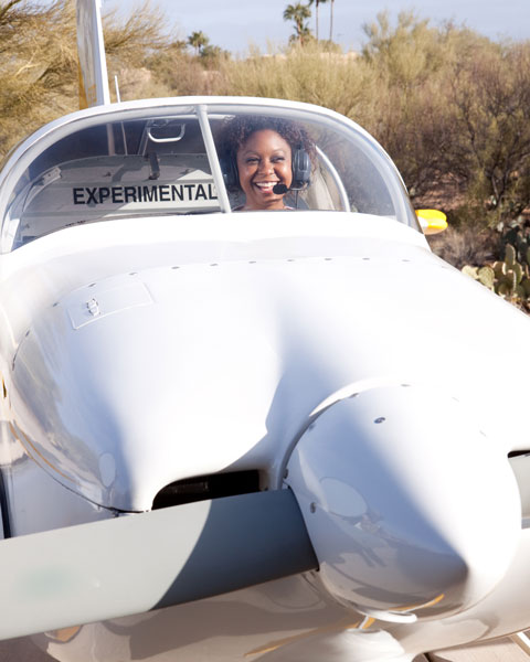 Smiling African American Woman training to become a pilot